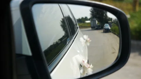 View of road in side mirror weding car Stock Footage 95208195