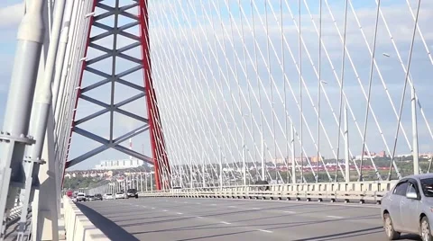 View on the road through the bridge with cloudy sky and moving cars Stock Footage 56587302