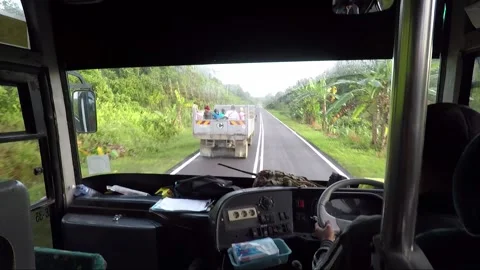 View of the road through the bus windshield, Sarawak, Malaysia, Borneo Stock-Footage 153862573