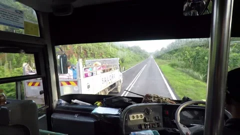 View of the road through the bus windshield, Sarawak, Malaysia, Borneo Stock Footage 153862620