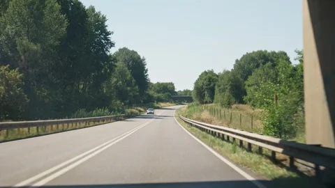 View of the Road Through the Car's Windshield Stock Footage 346370079