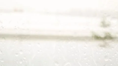 View of the road through the glass. Snow is falling. The window is wet. Stock Footage 175059887
