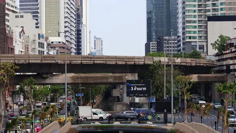View of road traffic and moving BTS skytrain at Chong Nonsi metro station. Stock Footage 278373824