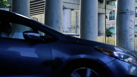 View on a road under the bridge with fast moving cars. Urbanistic view of the st Video stock 204936667