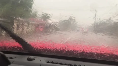 View of road from windshield while raining. Windshield wiper of car. Stock Footage 161078069