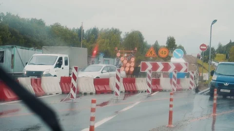 View of road works from the car window. It's raining outside Video stock 113998323