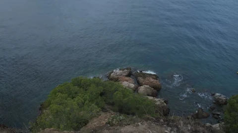 View From The Rock To The Sea. Camera Movement From Bottom To Top Stock Footage 100708591