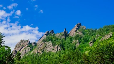 View of rock top, the flying clouds Video stock 112344640