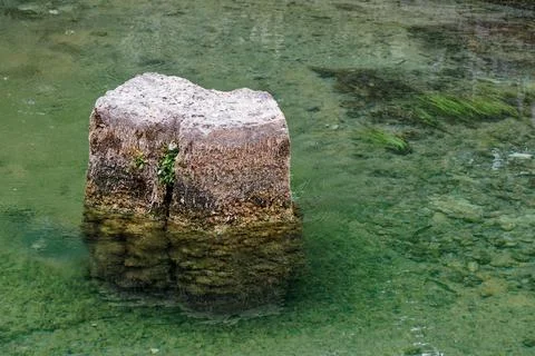View on rock in water Stock Photos