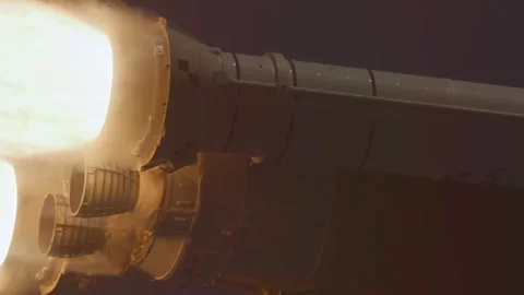 View of a rocket engine during launch showing intense fire and smoke exhaust. Stock Footage 334022383