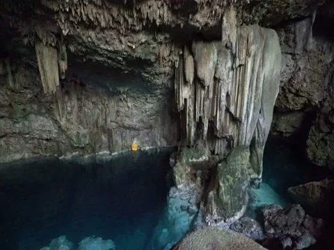 View of rocks in the underground cave and lake with chrystal blue water Stock Footage 71540724