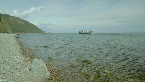 View of rocky coast and cliff of the Baikal lake coast. Pure water, waves Stock Footage 80879018