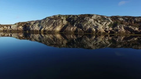 View of the rocky coast, which is located near the deep sea with a water surface Stock Footage 75465505
