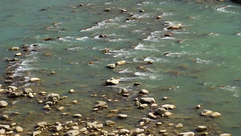View of a rocky river with flowing turquoise water, Nepal. Видео 335603712