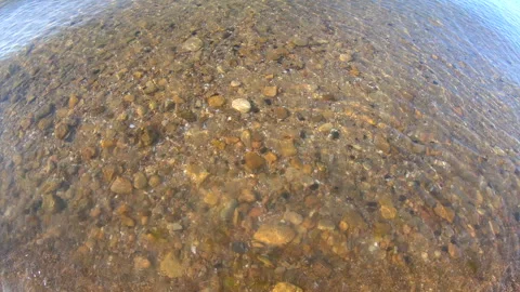 View rocky sandy sea bottom through clea... Stock Video Pond5