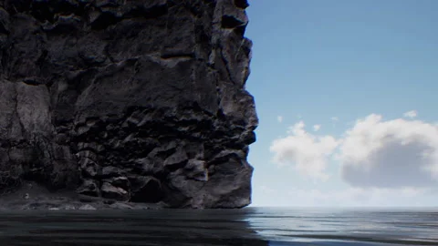 View of rocky shore along calm water under a clear sky with clouds Stock Footage 340613100