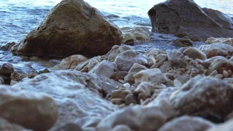 View of the rocky shore and the undulating sea Stock Footage 169370565
