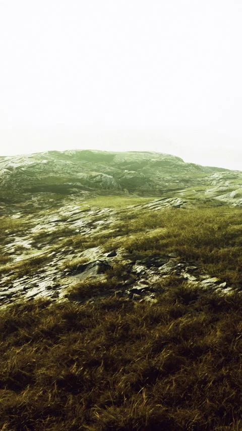 View of rocky terrain under a cloudy sky with patches of grass Stock Footage 334687538