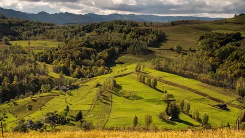 View of rolling green hills and autumn forests in Romania. Stock Footage 333527214