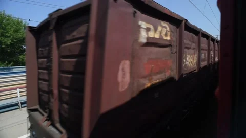 View of a rolling train with freight cars in the afternoon. Stock-Footage 129711213