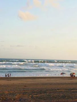 View of rolling waves on the beach in the afternoon Stock Photos