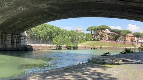 View on Rome from under the bridge on Tiber embankment in May Stock Footage 194536350