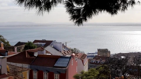 View on roofs and river Tejo, Lisbon, Portugal Video stock 123693727