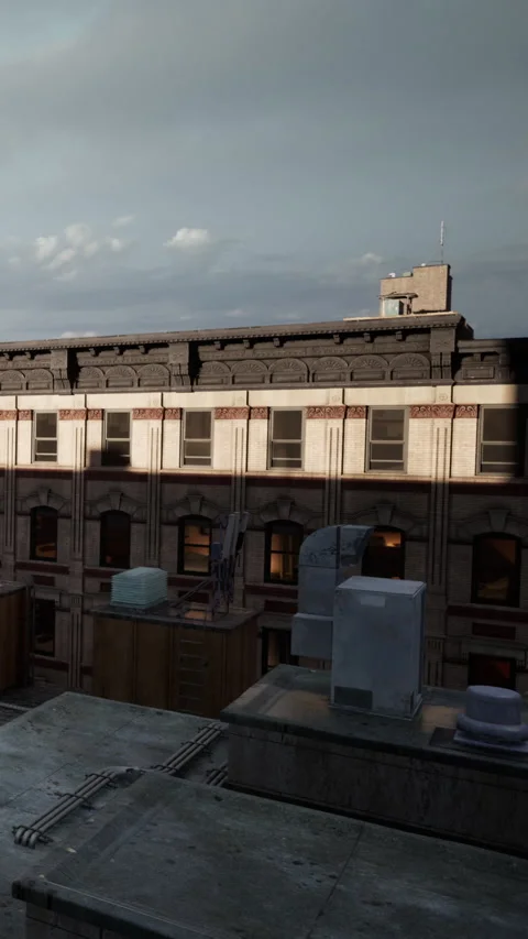 View of a rooftop with buildings and clouds in the sky at sunset Stock Footage 338350636