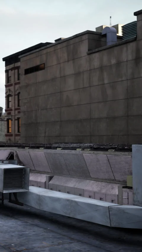 View of a rooftop with ventilation system and building in the background Stock Footage 340649433