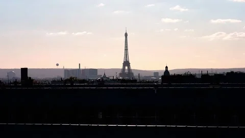 View of rooftops and Eiffel Tower with the sunset sky in Paris, France Stock Footage 299380647