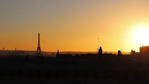View of rooftops and Eiffel Tower with the sunset sky in Paris, France Stock Footage 299390355