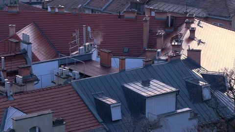View of the rooftops of Budapest. Smoke comes from the chimney of the house. Stock Footage 121057182