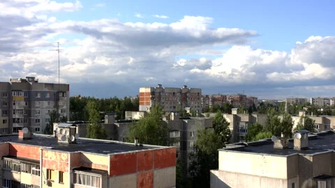 View of the rooftops of the city with clouds Stock Footage 245876931
