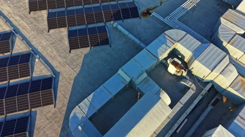 View of rooftops with solar panels installed at a commercial building in an Stock Footage 341597163