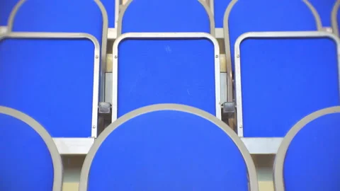 View of the rostrum from the rows of empty blue places. Stock Footage 95431952