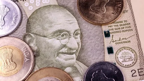 View of rotating 10, 20, 50, 200, 500 Indian rupees, brand new notes and coins. Stock Footage 294599729