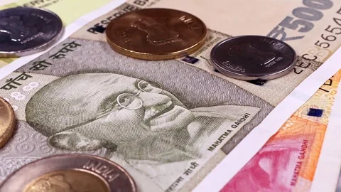 View of rotating 10, 20, 50, 200, 500 Indian rupees, brand new notes and coins. Stock Footage 294599872