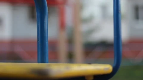 The view from the rotating blue carousel in the playground in a circle is blurry Видео 130497167