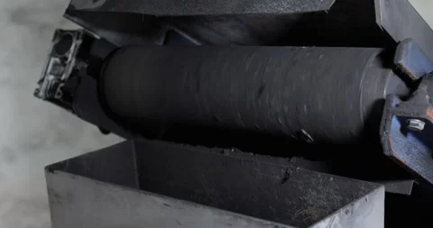 View of rotating roller for recycling battery with waste tray. Stock Footage 151848550