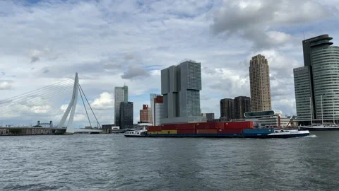 View of Rotterdam at river Maas with barge passing Stock Footage 138719614