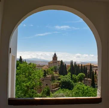 View from a round arched window of a summers country scene. Stock Photos
