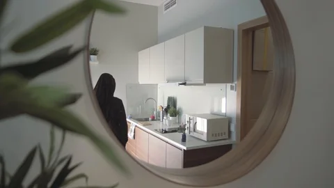 View from the round Mirror a pretty slender Arab woman in traditional clothes Stock Footage 113749418