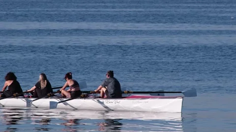 View of a rowing team training on the water at Caddebostan Coast, Turkiye. Stock Footage 343878880