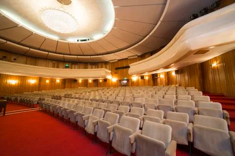View on rows of chairs in empty cinema hall Stock Photos