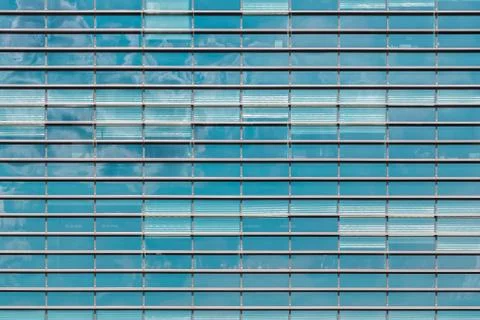 View of rows of windows on modern office building. Texture for background Stock Photos