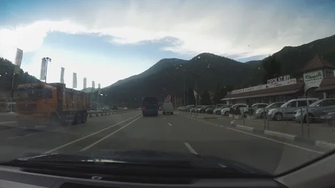View of Roza Khutor through windscreen of moving car Stock Footage 106589416