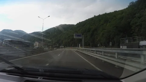View of Roza Khutor through windscreen of moving car Stock Footage 106591091