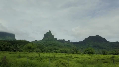 View of rugged mountains while driving in Tahiti in slow motion Stock Footage 307262981