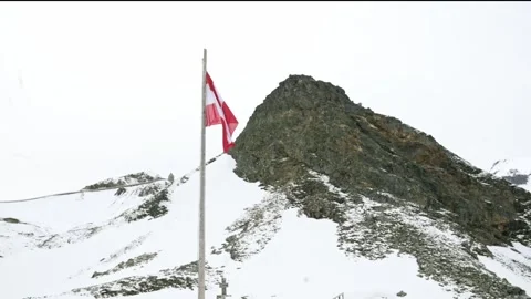 A view of a rugged, snow-covered mountain peak in Grossglockner, Austria, with Video stock 282149399