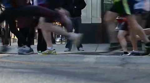 View of runners' shoes as they quickly pass by Stockbeeldmateriaal 36783869
